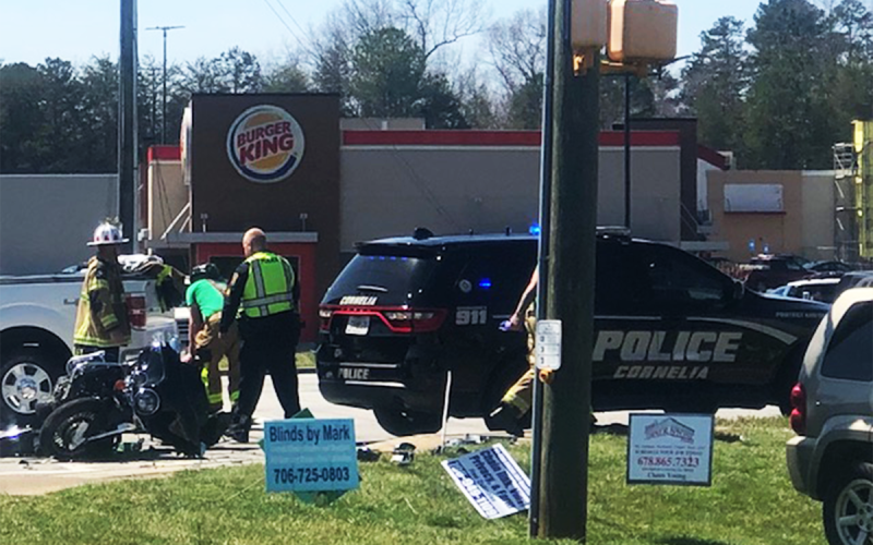 Responders work the scene of a motorcycle accident near the Cornelia Burger King on Monday afternoon. AMARIS E. RODRIGUEZ/Staff