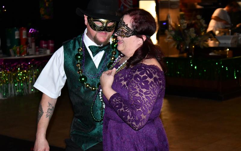Masks and festive attire were all the rage at Clarkesville’s Mardi Gras event on Saturday night. MATTHEW OSBORNE/Staff