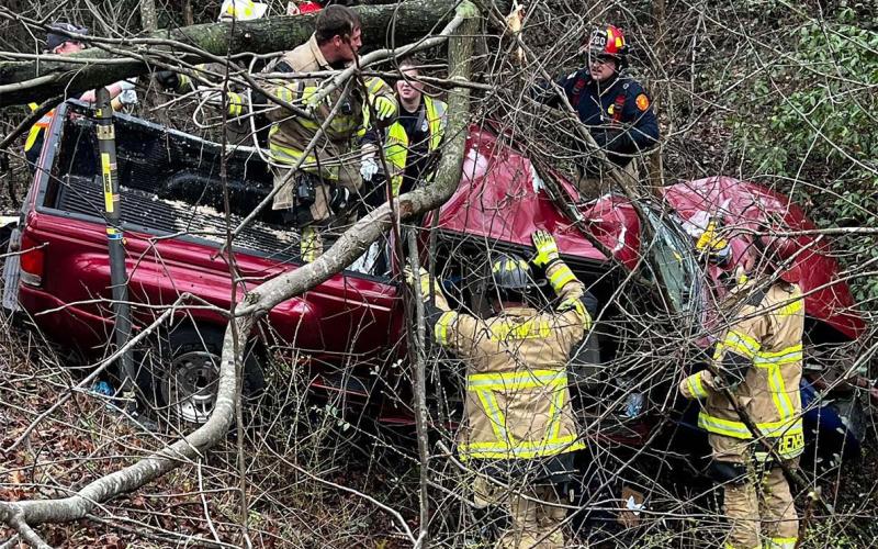 First responders try to assess the condition of the driver after an accident on J. Warren Road on Wednesday afternoon. SGT. DANIEL SEELEy/Submitted