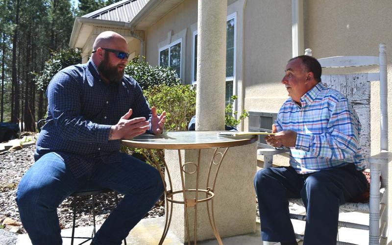 Nathan Dodd (left) receives counseling from licensed counselor Mark Beach. BRIAN WELLMEIER/Staff