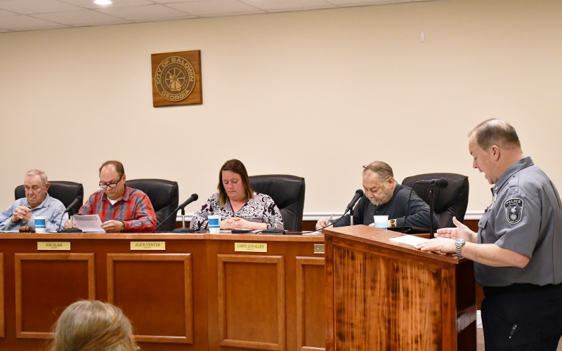 Baldwin Police Chief Jeff Branyon (right) speaks to Baldwin City Counil on Monday night. BRIAN WELLMEIER/Staff