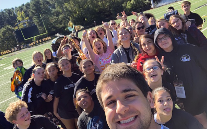New Band of Blue Director Jacob Weinstein takes a selfie with his former band members at Temple High School. JACOB WEINSTEIN/Submitted