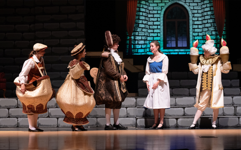 Chip, played by Chaise Arpke, Mrs. Potts, played by Ansley Broome, Cogsworth, played by Aiden Stickel, and Lumiere, played by Zoe’ Simmons all advise Belle on the Beast’s grand temperament. ZACH TAYLOR/Special