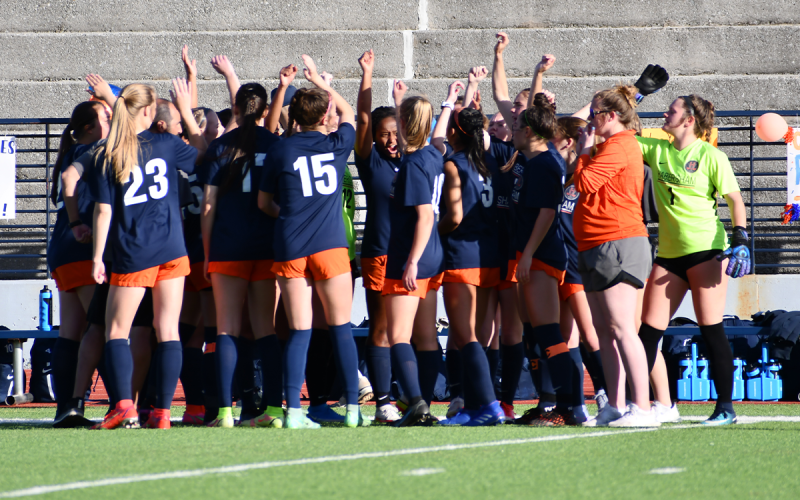 The Lady Raiders raise their fists before breaking the pre-game huddle just before their first-round state playoff game. CODY ROGERS/Staff