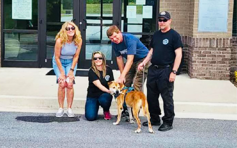 Some of Grado's two-legged friends: Deborah Schildbach, Madi Nix and ACO officer Bill Ireland. MADI NIX/Submitted