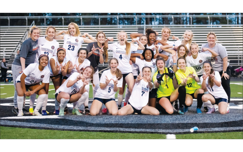 The Habersham Central girls soccer team posed at midfield – flexing their arms and holding up Ws with their fingers – after their intense, penalty kick win over Shiloh. REAGAN TURNER/Special