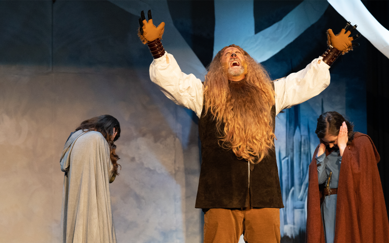 The Lion Aslan, played by Joshua Garrett, roars in pride alongside sisters Susan and Lucy Pevensie, who cover their ears from the noise. ZACHARY TAYLOR/Special