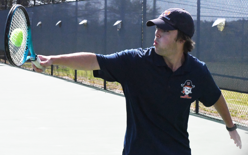 Senior and No. 1 singles player Ray Carr connects with a ball during his match in the first round of the state playoffs. CODY ROGERS/Staff