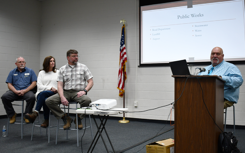Habersham County Chairman Bruce Palmer makes a presentation at a town hall meeting Tuesday as public works leaders (from left) Steve Worley, Laurie Church and Jerry Baggett listen. MATTHEW OSBORNE/Staff