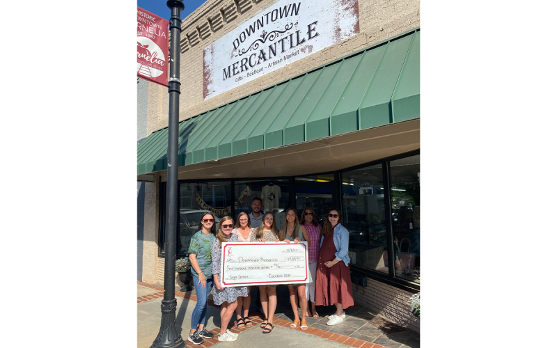The Downtown Mercantile was the recipient of a facade grant for a new sign. Left to Right: Lindsey Holt, Emily Herrin, Jessie Owensby, Heath Barrett, Breanna Meister, Nicole Davis, Sarah Higgins, and Cagney Meads. LINDSEY FITZGERALD/Submitted