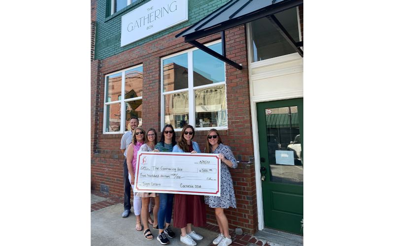 The Gathering Box received a sign grant from the City of Cornelia to be used towards a new sign for their downtown location. Pictured Left to Right: Heath Barrett, Sarah Higgins, Jessie Owensby, Lindsey Holt, Cagney Meads, and Emily Herrin. LINDSEY FITZGERALD/Submitted