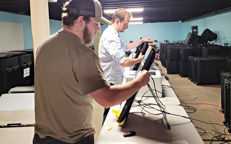 Habersham County Election Tech/Coordinator Izac Martin and Poll Manager Derek LaPerriere conduct the logic and accuracy testing on Habersham County’s voting machines in preparation for the primary Tuesday, May 24.