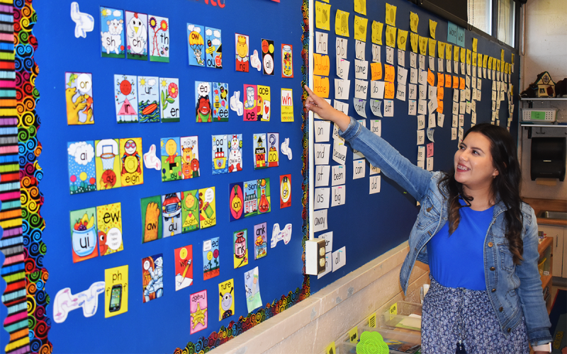 Jobana Campos points in excitement as she tours her future classroom. Campos will begin teaching first grade at Baldwin Elementary School this fall. AMARIS E. RODRIGUEZ/Staff