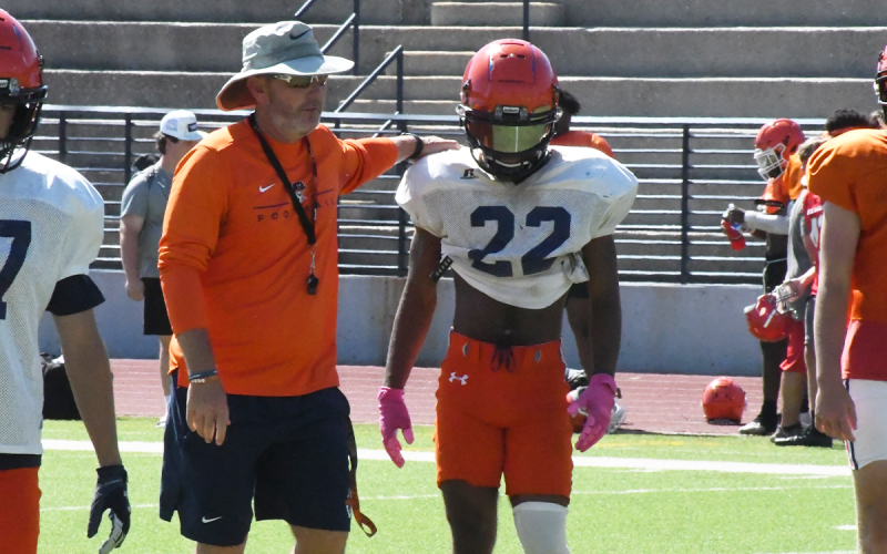 Raiders coach Benji Harrison gives instructions to players during the scrimmage. MATTHEW OSBORNE/Staff