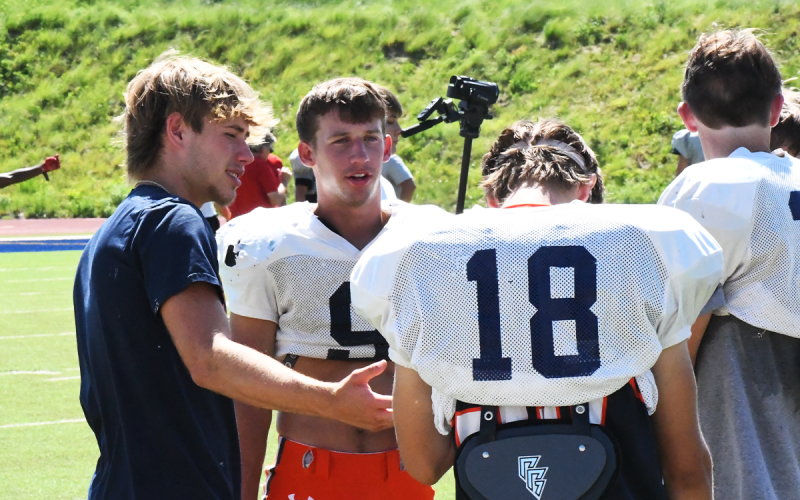 Habersham Central graduate and future Point University football freshman Caleb Wade, last year’s team MVP, gives sage advice to the Raiders at Wednesday’s practice. MATTHEW OSBORNE/Staff