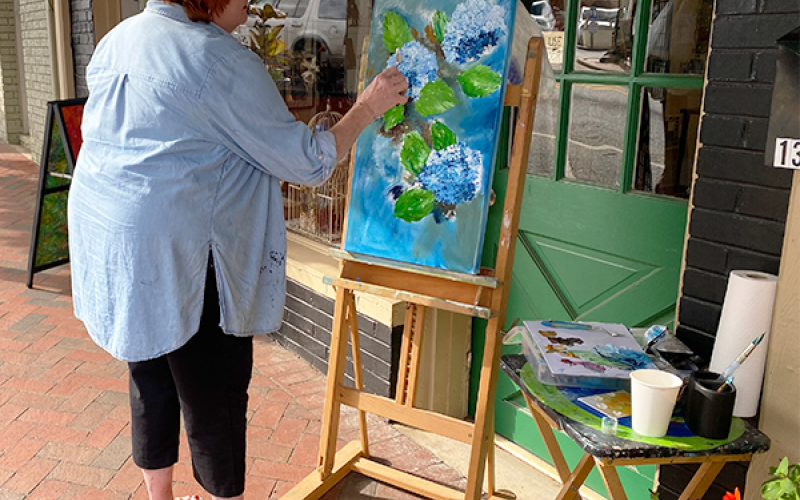 Artist Nancy Ackerman works on her latest masterpiece for patrons to enjoy. YVONNE MARINELLI/Staff