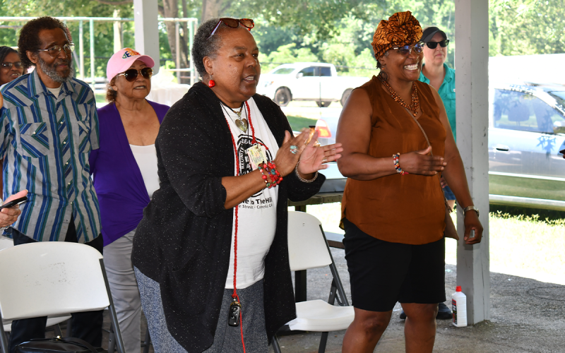 Sandra Davenport and Betty Major sing along to the Black national anthem at the Juneteenth celebration at Jim Smith Park on Saturday. MATTHEW OSBORNE/Staff