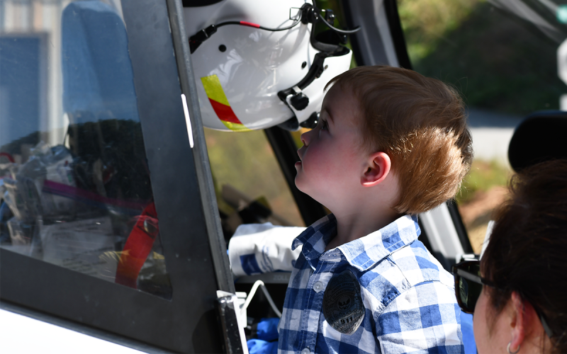 Jonah Cowart takes a good look at the inside of a medical helicopter that was one of many emergency vehicles on hand for the event. MATTHEW OSBORNE/Staff