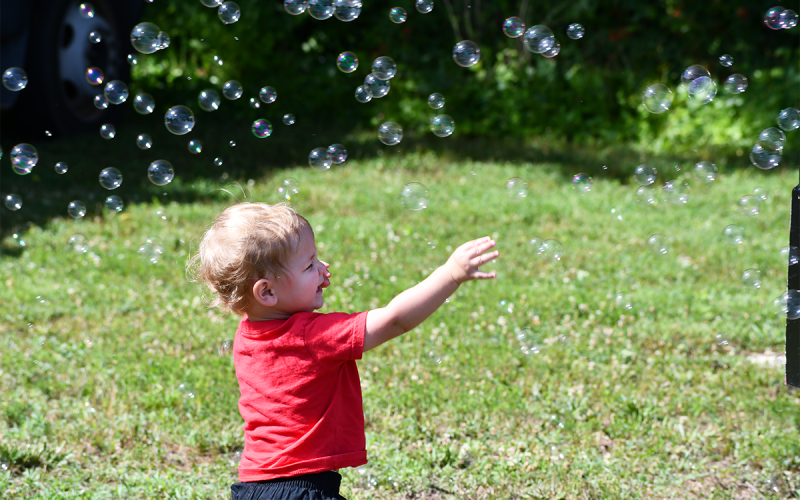 Luke Sargent loved the bubble machine at the Kids on Wheels event in Clarkesville on Saturday. There was fun of all kinds for youngsters to enjoy on a summer day. MATTHEW OSBORNE/Staff