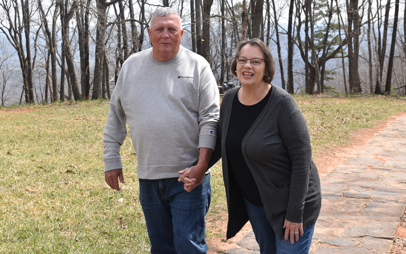 Michael and Nancy Lewallen take a walk together near the Chenocetah Tower. The Habersham natives have been married more than 50 years. AMARIS E. RODRIGUEZ/Staff