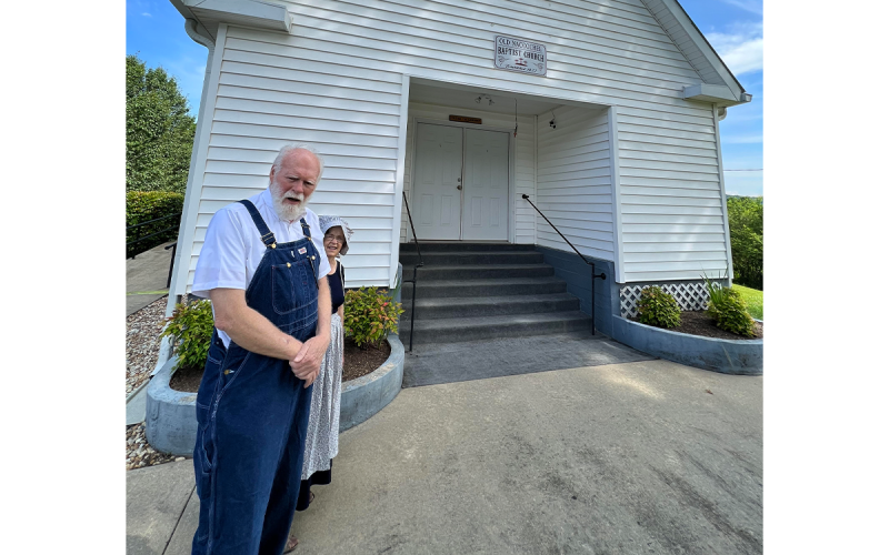 Mike Payne and Rachel Berry, two longtime church members, prepare to go inside for the start of worship Sunday morning. WAYNE KNUCKLES/CNI News Service