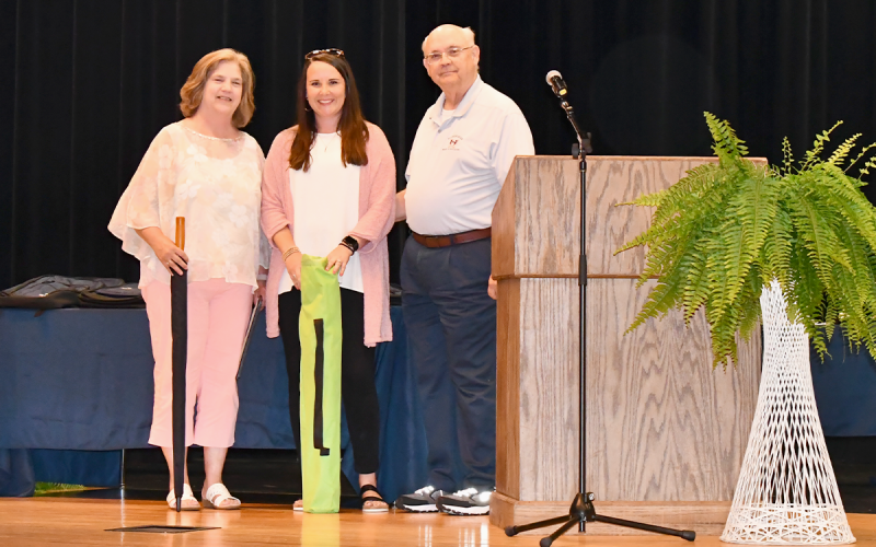 From left are Simpson, Ansley Kristy of Peach State Federal Credit Union and Barron. ROWAN EDMONDS/Staff