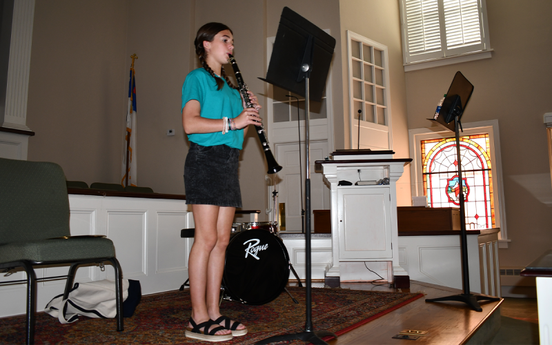 Sydney  Patterson plays the hymn of “Crown Him with Many Crowns” on clarinet. BRIAN WELLMEIER/Staff
