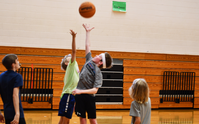 Breckin and Chance go for a jump ball at the beginning of a scrimmage. MATTHEW OSBORNE/Staff