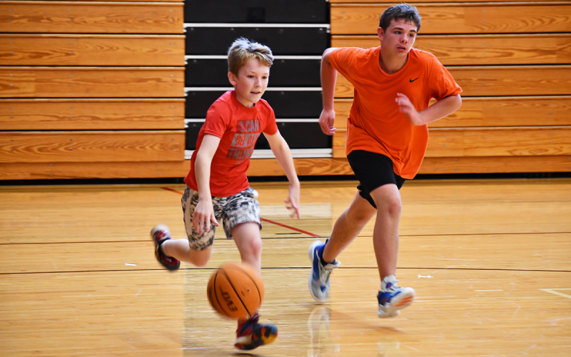 Myles runs the floor on a fast break with Eli. MATTHEW OSBORNE/Staff
