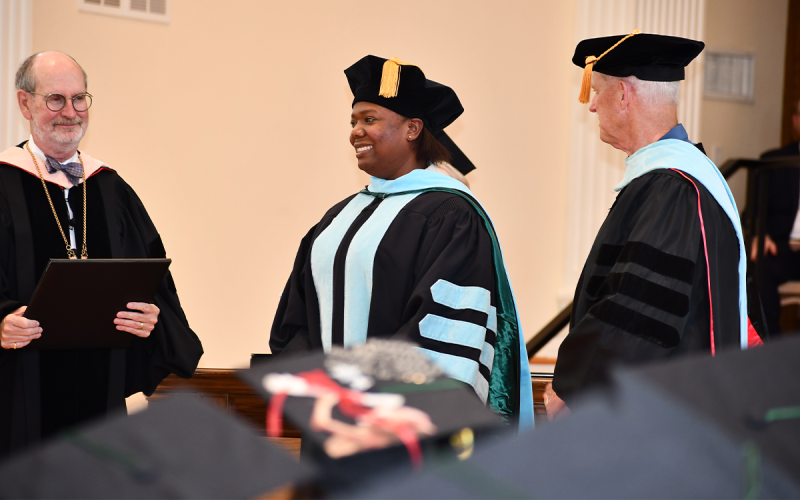 One distinguished graduate was the newly-minted Dr. Wilnia Aristilde (center), who received her doctorate of education. MATTHEW OSBORNE/Staff