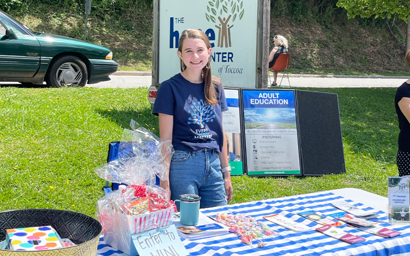 Family Support Specialist Campbell Weidemeier works a  station at a resource fair at Hope Center in Toccoa. MELANIE ALLEN/Submitted