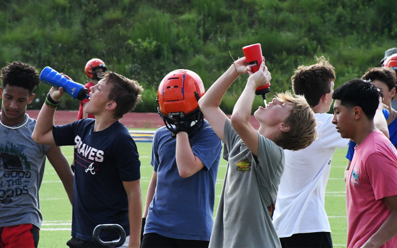 Middle school players look to beat the heat during Tuesday morning’s practices. MATTHEW OSBORNE/Staff