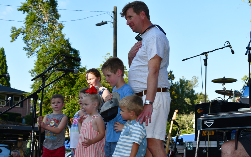 A few local kids helped Demorest Mayor Jerry Harkness say the Pledge of Allegiance before  the concert began  Monday night. MATTHEW OSBORNE/Staff