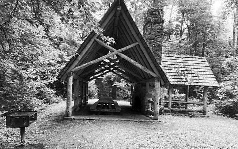 A section of the recreation area containing a covered table, fireplace, and grill. The wooden structures were built as part of the Civilian Conservation Corps program under FDR and are open for anyone to enjoy during area hours. JENNIFER RAMSAY/Staff