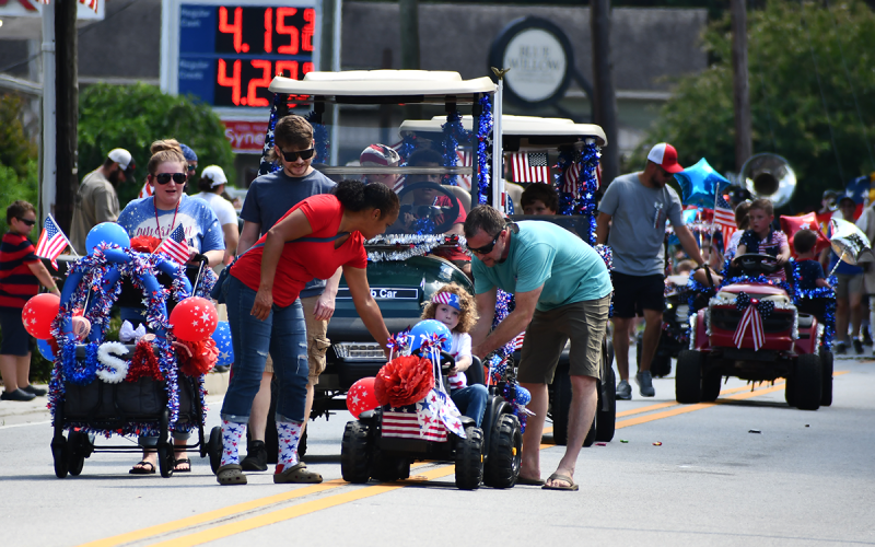 Some parade vehicles had a little engine trouble, but that did not dampen the patriotic spirit of participants young and old. MATTHEW OSBORNE/Staff