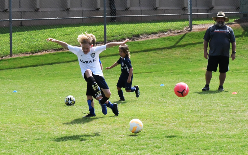 Clay Terrell flies through the air during a dodging drill. MATTHEW OSBORNE/Staff