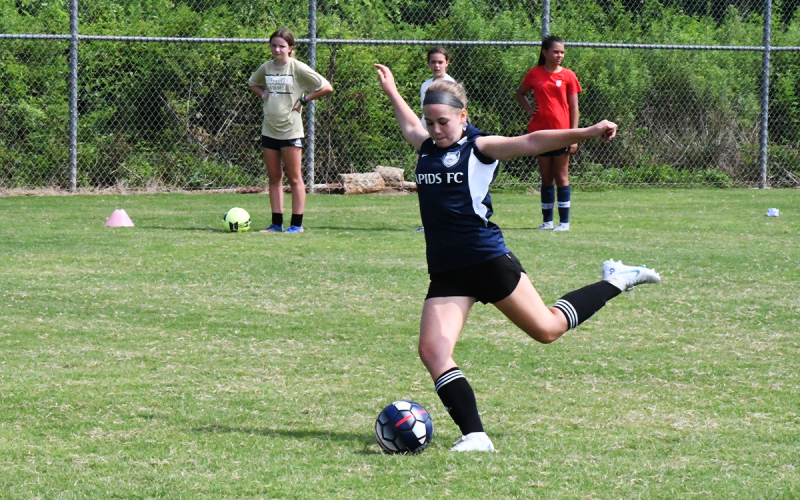 Emily Savage gets ready to strike during a shooting drill. MATTHEW OSBORNE/Staff