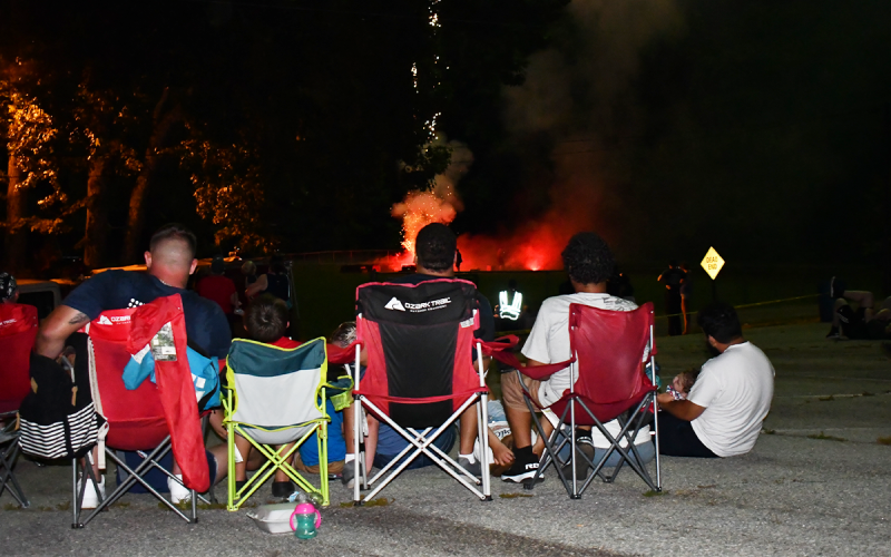 Folks got comfortable behind Demorest’s future city hall to enjoy the fireworks show Monday night. MATTHEW OSBORNE/Staff