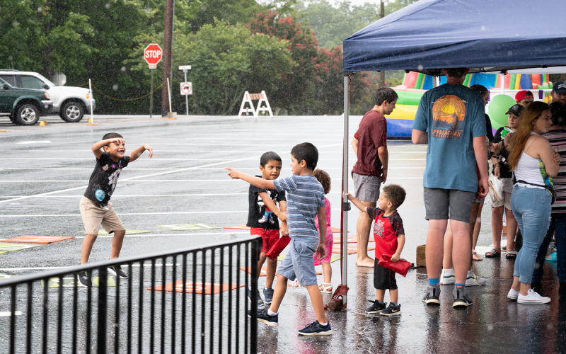 Heavy rain struck while Cornelia United Methodist Church’s back-to-school block party event Sunday was winding down, but that did not stop a group of kids from dancing in the rain. ZACH TAYLOR/Special