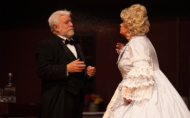 After the Underling, played by Pat Chastain, mistakenly brings Mrs. Tottendale, played by Susan Watson, the wrong drink, she promptly spits it on his jacket. ZACH TAYLOR/Special