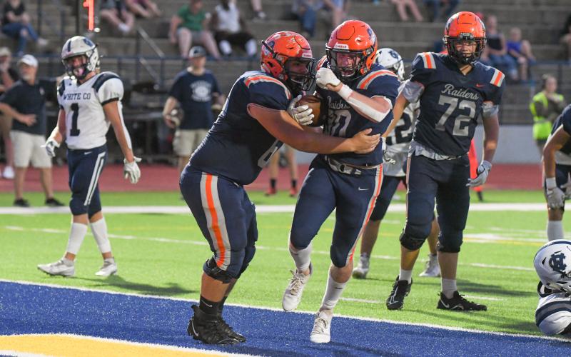 Habersham Central’s Blandon Grizzle celebrates a touchdown with lineman Eddie Jenkins. TOM ASKEW/Special