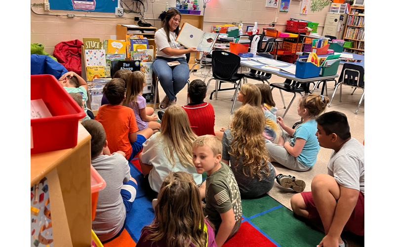 Morgan Pitts reads to students at Clarkesville Elementary. JALEN HULSEY/Submitted