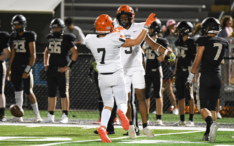 Braden Henslee (7) and Somdee Satiphone Jr. celebrate a turnover on Friday night at Valhalla. TOM ASKEW/Special