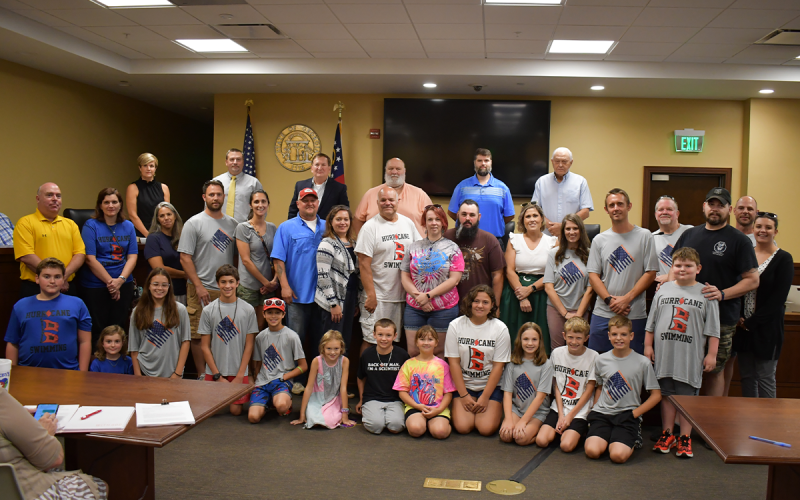 Swimmers and parents in the Habersham Hurricanes swim team were honored Monday by the Habersham County Board of Commissioners. MATTHEW OSBORNE/Staff