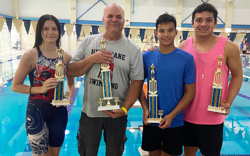Hurricanes members Leah Culpepper, Coach Mike Krippner, Jayden Martinez, Josh Martinez show off hardware from one of their competitions this summer. SUBMITTED