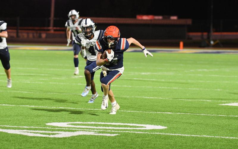 Habersham Central’s Canon Wilbanks gets a head start on everyone after catching an out pass Friday against White County. Wilbanks raced all the way to the end zone for a game-tying touchdown and added another in the fourth  quarter to seal the game. TOM ASKEW/Special