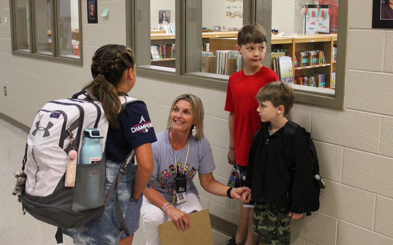 New Fairview Elementary Principal Michelle Wilbanks talks with students before the beginning of the first day of school. ROWAN EDMONDS/Staff
