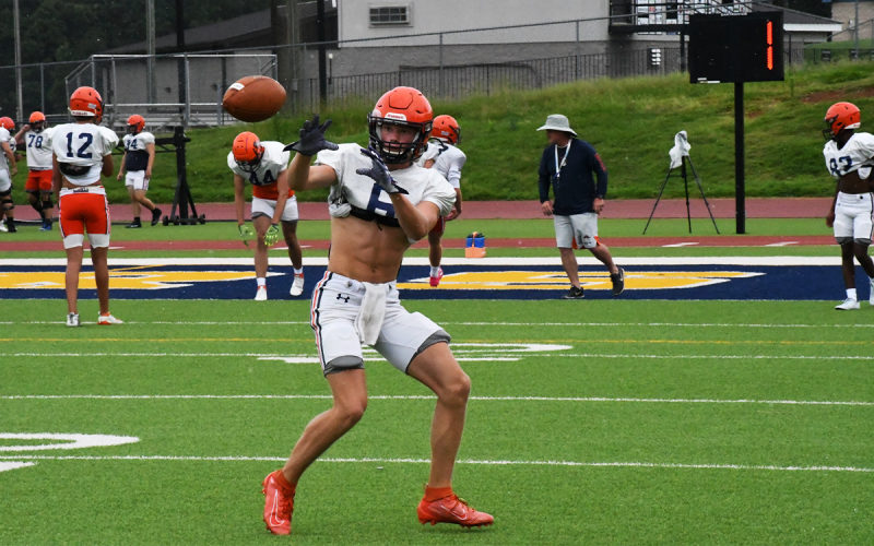 Jonah Wilson hauled this pass in during receiver drills as the Raiders prepared for Friday night, when they will get to hit someone else during their preseason visit to East Hall. MATTHEW OSBORNE/Staff