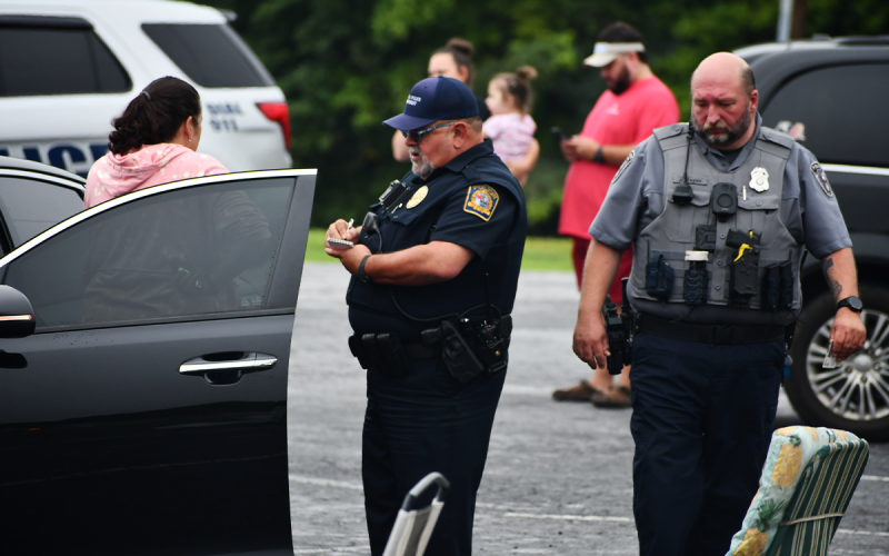 Cornelia Police interviews Mary Leigh Sheriff-Welborn (left) at the scene of a Sept. 3 shooting. MATTHEW OSBORNE/Staff