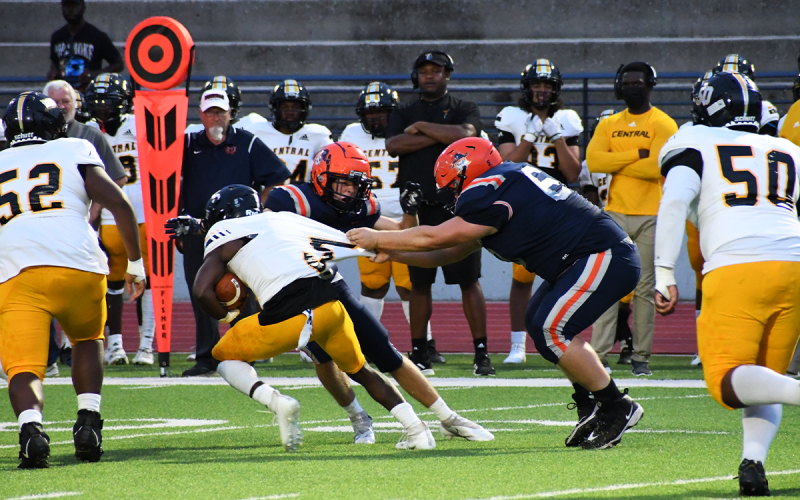 Habersham Central’s Landen LaPrade gets a hold of Central Gwinnett’s Makhi Cunningham by the jersey and does not let go on the way to making the stop. MATTHEW OSBORNE/Staff